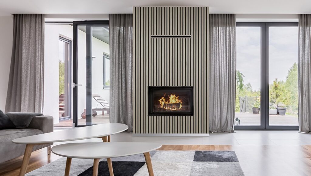 Modern Living Room with Glass Doors Looking at a Forest Featuring Quanti Series Grey Oak FibroTech Acoustic Panels