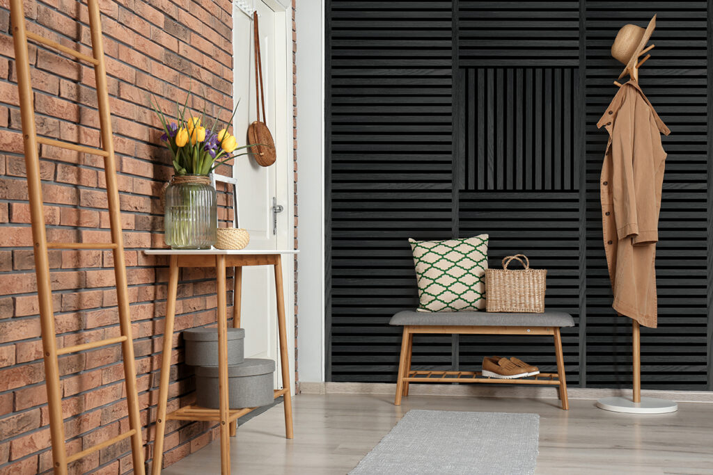 Room With Brick Wall Featuring Square Series Black Oak FibroTech Acoustic Panels